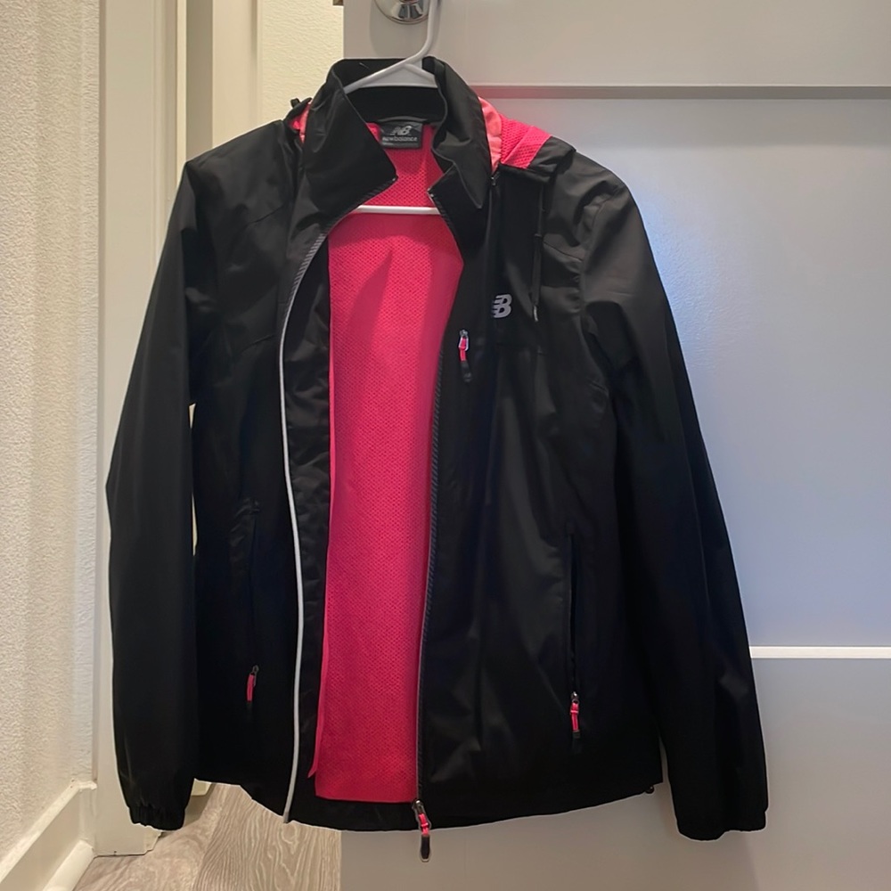 New balance windbreaker with roll up hood